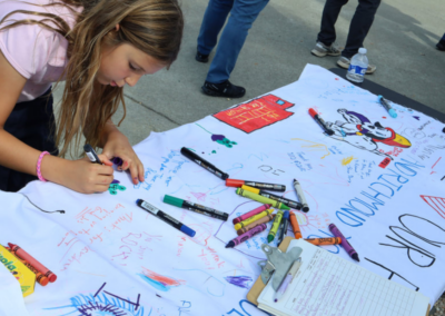 fire station 63 open house child writing on poster with markers and crayons WCCFSC 20250118