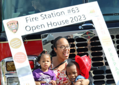 fire station 63 open house mother and 2 kids with square cutout WCCFSC 20250118