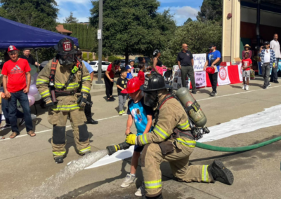 fire station 63 open house two fireman show how to use hose WCCFSC 20250118