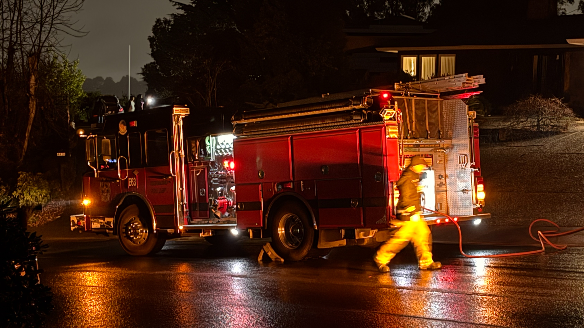 A Richmond Fire Department's fire truck on a night call on a rainy night